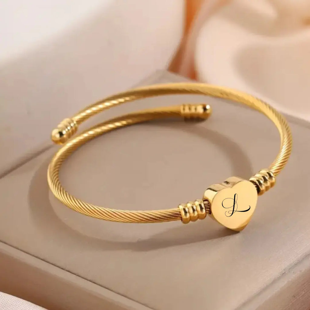 bracciali in acciaio inox colore oro personalizzati con nome, lettera iniziale.