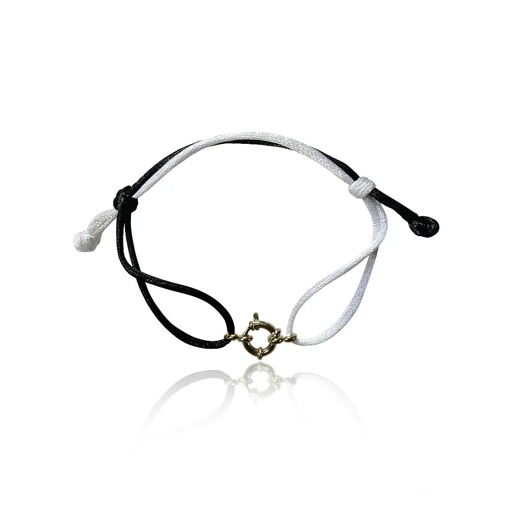 bracciale in filo colore bianco e nero con ciondolo fermaglio marinaio in acciaio inox colore argento. Regalo donna uomo pero ogni occasione.