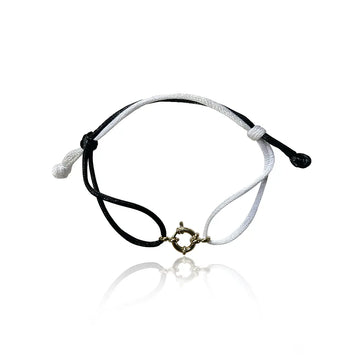 bracciale in filo colore bianco e nero con ciondolo fermaglio marinaio in acciaio inox colore argento. Regalo donna uomo pero ogni occasione.