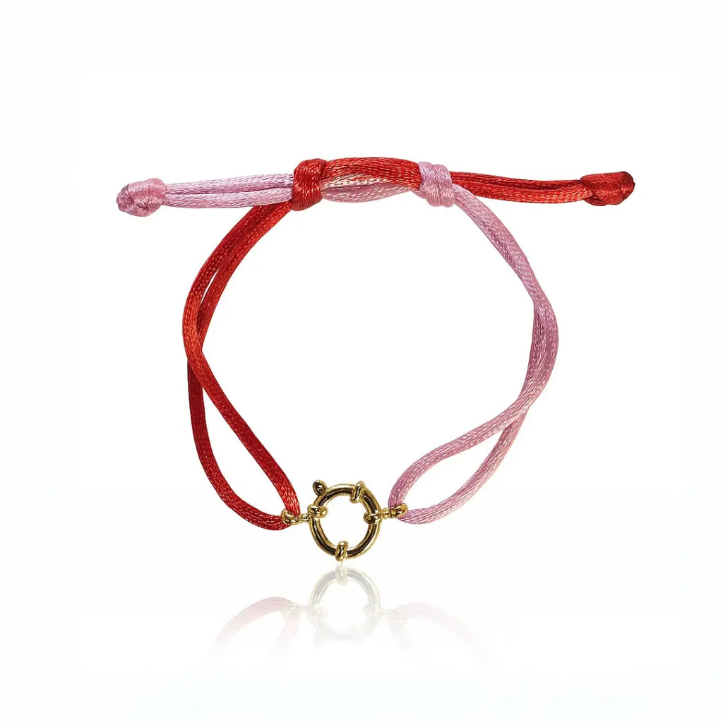 bracciale in filo satinato colore rosa e rosso con ciondolo fermaglio marinaio in acciaio inox colore oro. Regalo per donna  e uomo per ogni occasione.